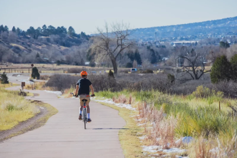 Person riding their bike along trail